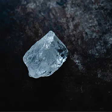 A piece of diamond on a dark surface