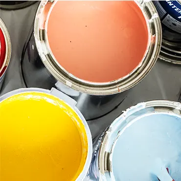 A group of paint cans with different colors